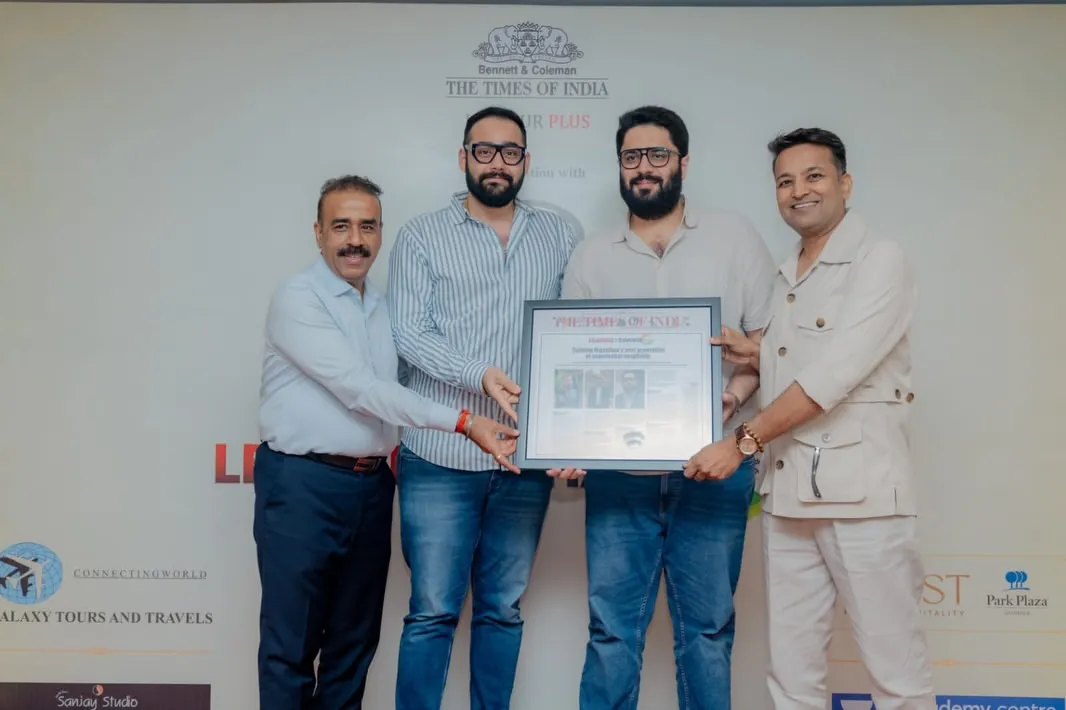 HST Hospitality team members holding a certificate